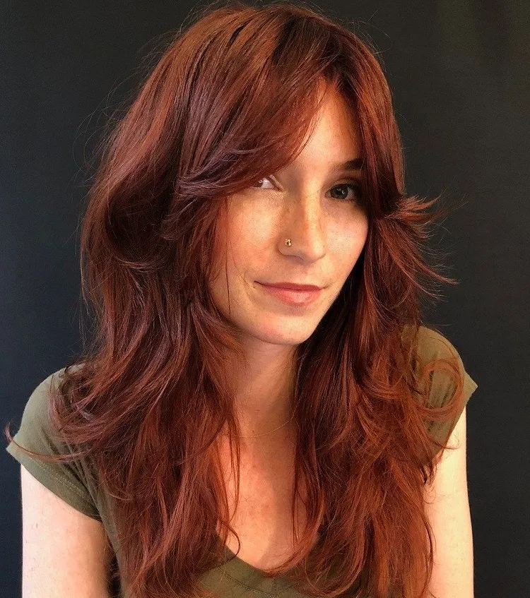 long red hair with curtain bangs and layers hairstyle trends 2023