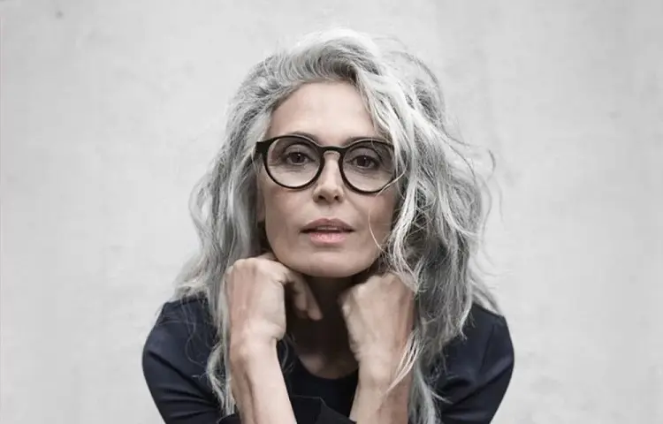 long wash and wear haircut with glasses for women over 60