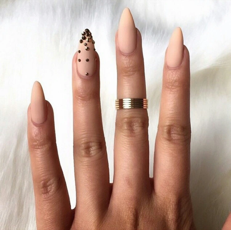 matte manicure in nude color with rhinestones