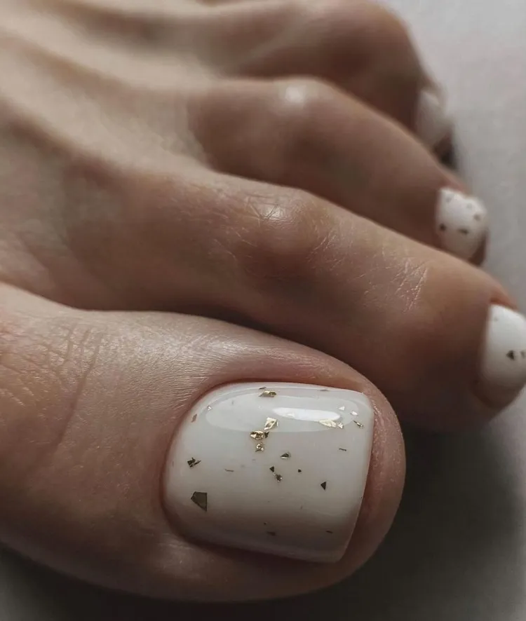milky white gold leaf simple aesthetic toe nail design