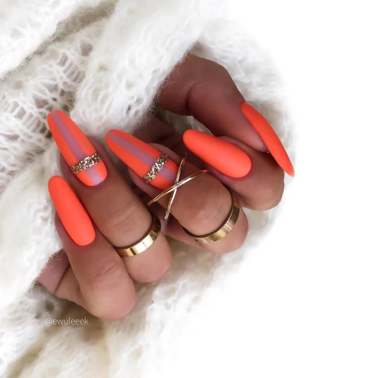 neon manicure trends 2023 orange and glitter
