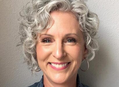 pixie haircut for curly hair with side bangs for women over 60