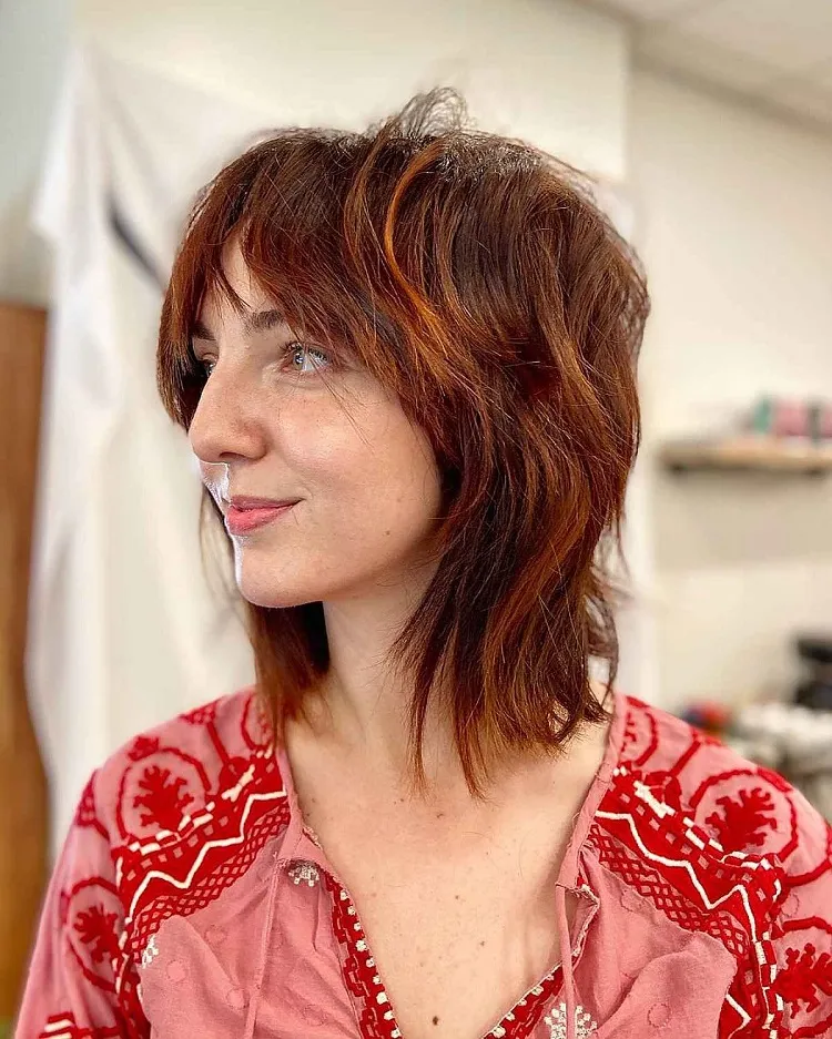 red shoulder length shaggy bangs hairstyle