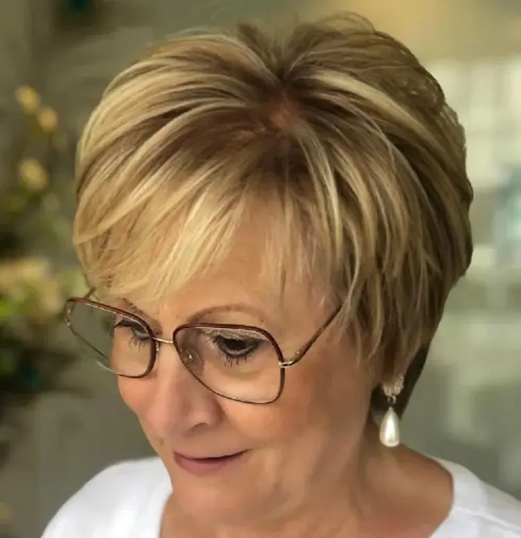 short feathered hairstyle for women over 60 with glasses hair trends 2023