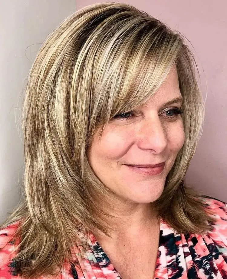shoulder length haircut with side bangs for women over 50