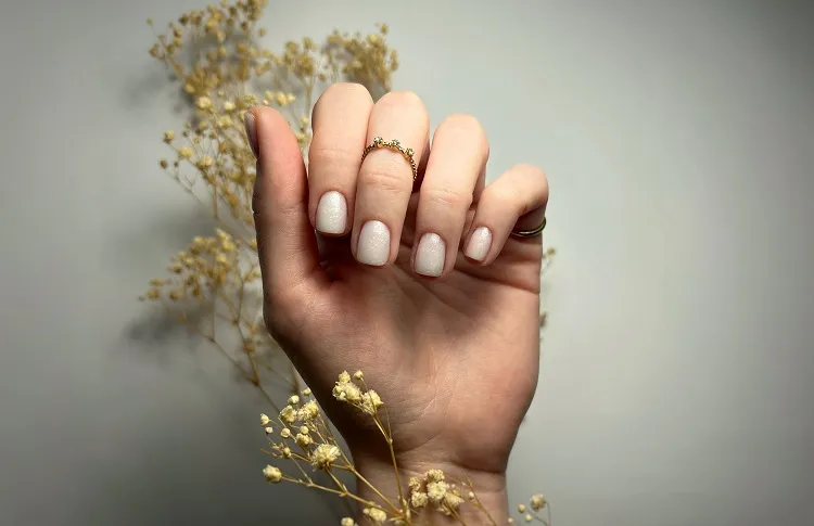 simple milky nude nails for women over 50