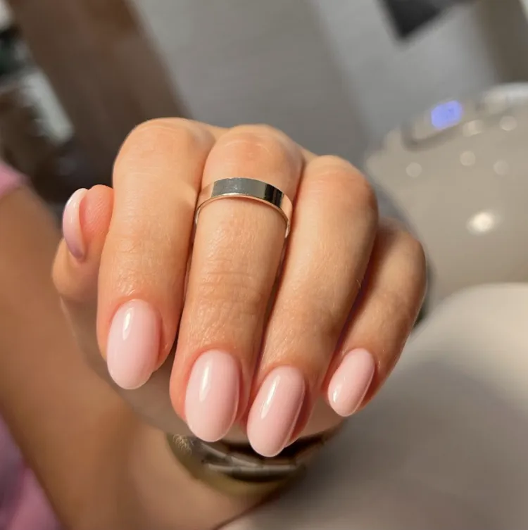 simple minimalist nude short oval nails manicure women over 50
