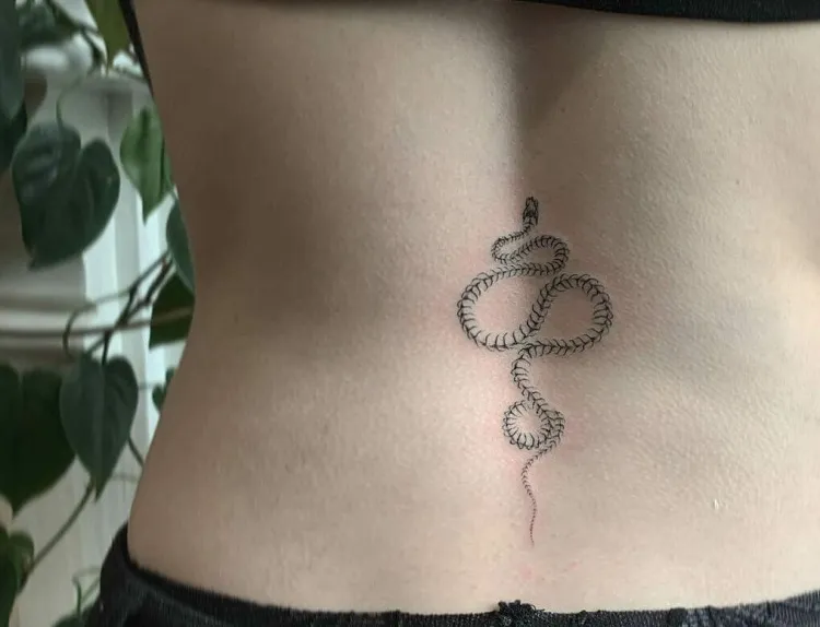 Tia lovett tattoos - Cute little snake spine tattoo 🐍 | Facebook