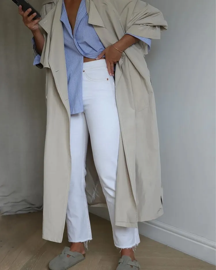 style birkenstock clogs white jeans blue shirt classic beige trench coat everyday look inspo