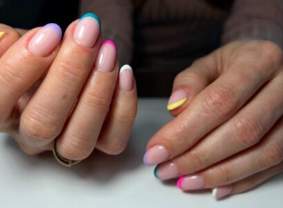 trendy colorful mismatched french tips manicure short oval nails for mature women over 50