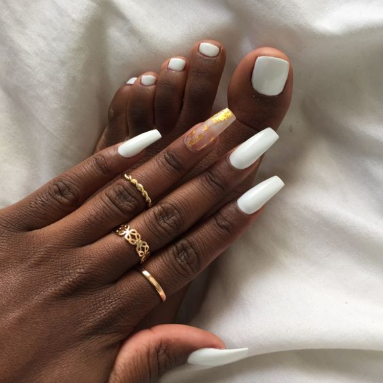 white matching manicure pedicure long ballerina nails gold rings dark skin woman