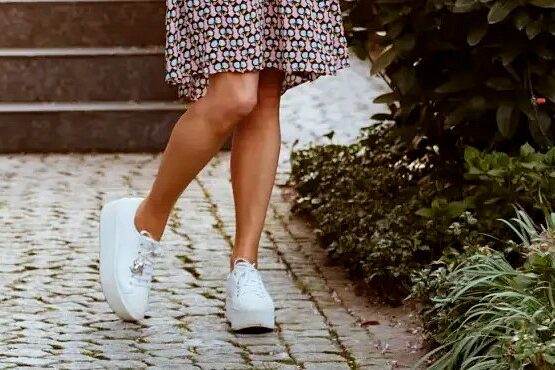 white sneakers for women over 50 combined with a dress