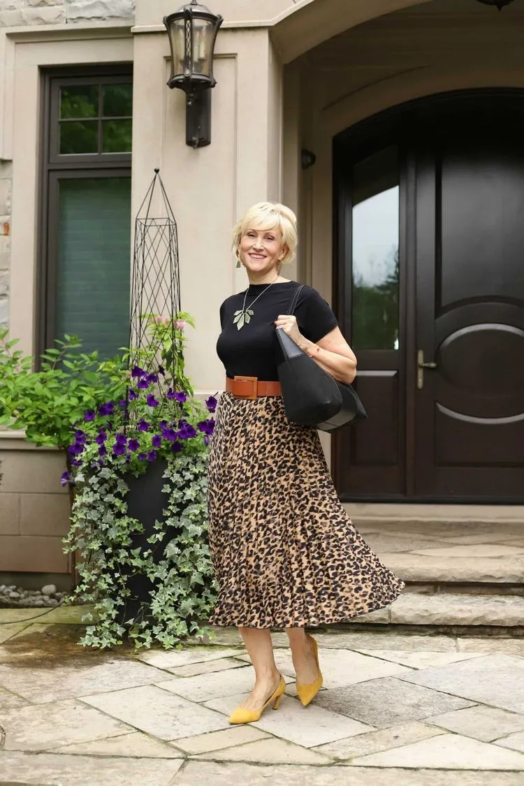 combine a pleated skirt with a t shirt for a casual outfit