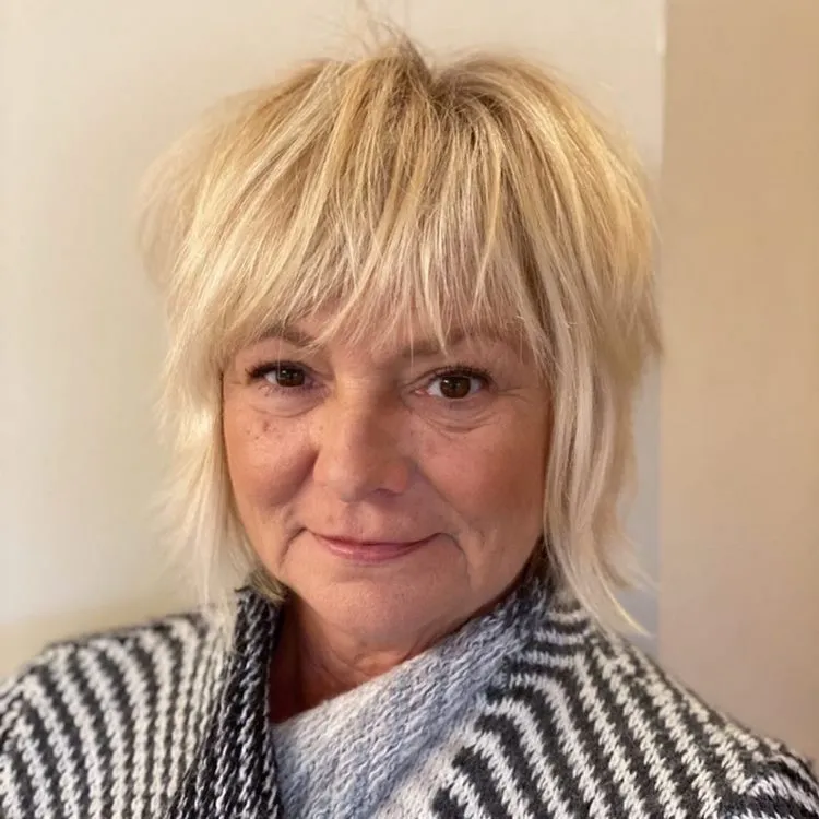 short shaggy bob with bangs for women over 50 with fine hair