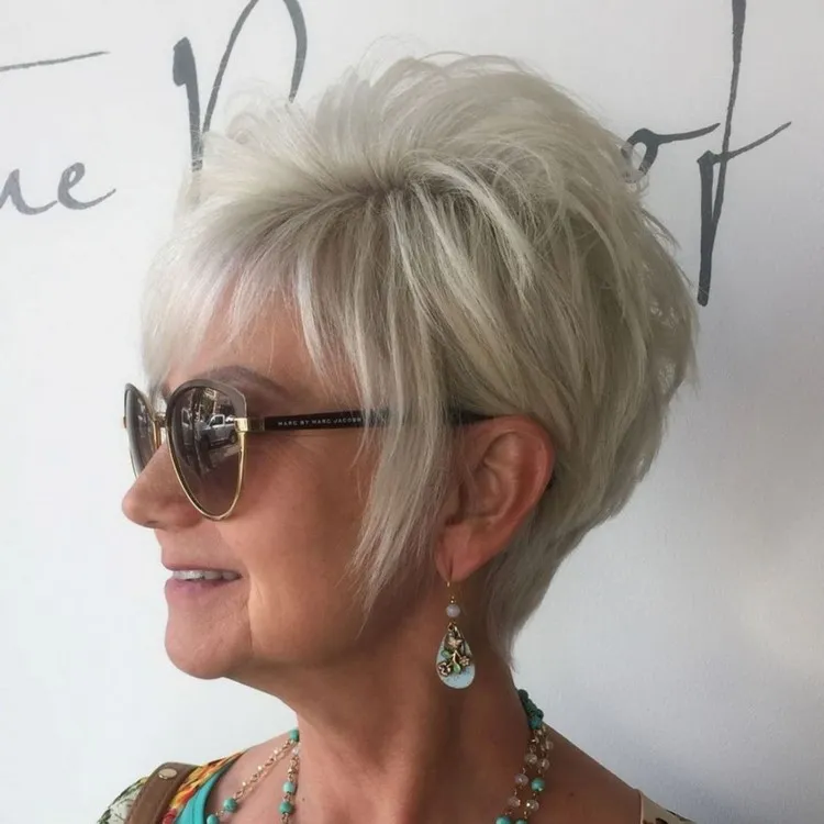 trendy pixie with sideburns feathered haircut for women over 60 with thin hair
