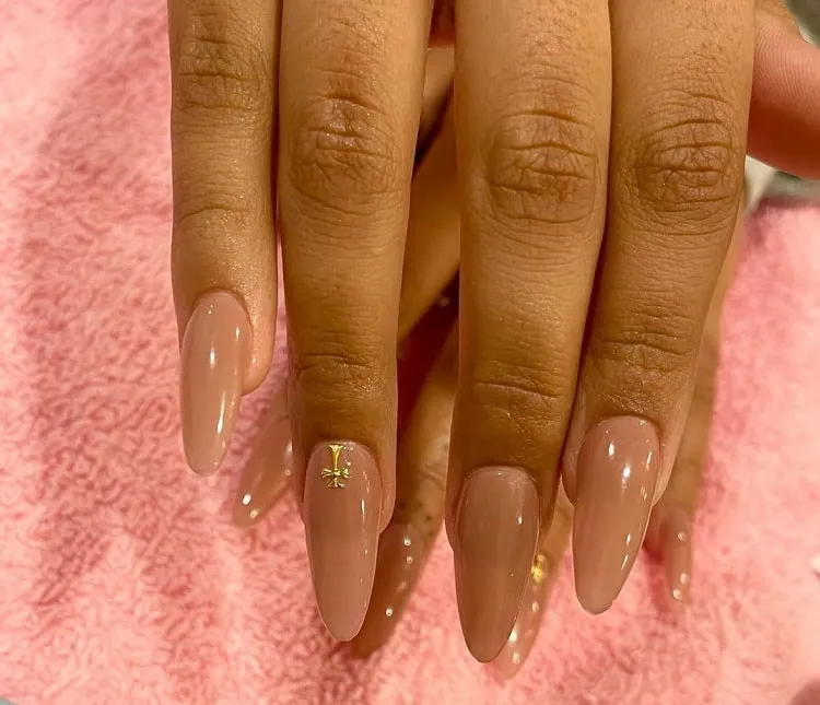 beautiful nude pink manicure on dark skin