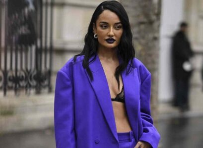 black lace lingerie bra oversized vibrant purple suit street style fashion week