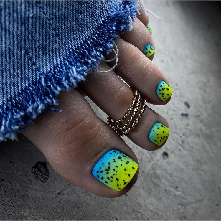 blue neon yellow ombre black nail polish splatter summer pedicure design ideas trends 2023 tanned skin