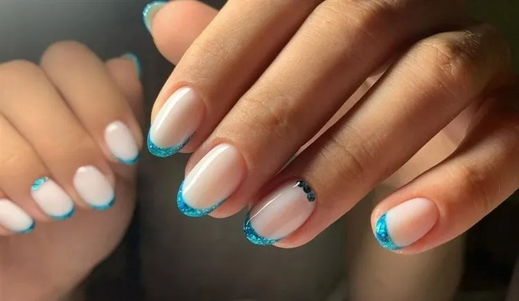 chic manicure ideas milky french nails with blue glitter tips