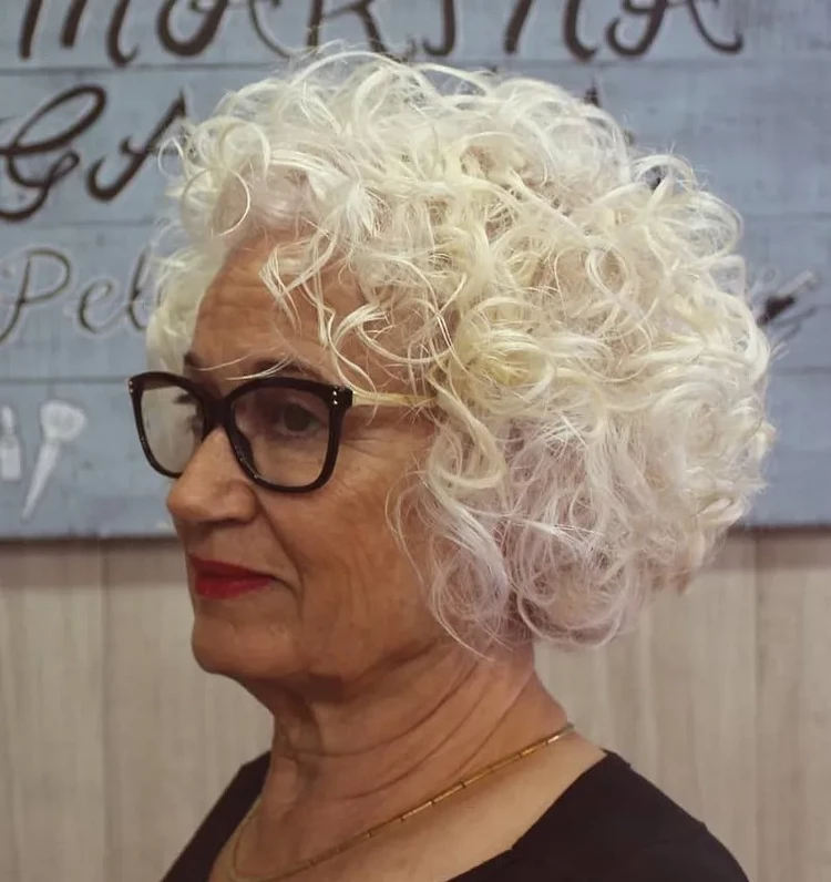 curly layered bob for older women with thin hair and glasses