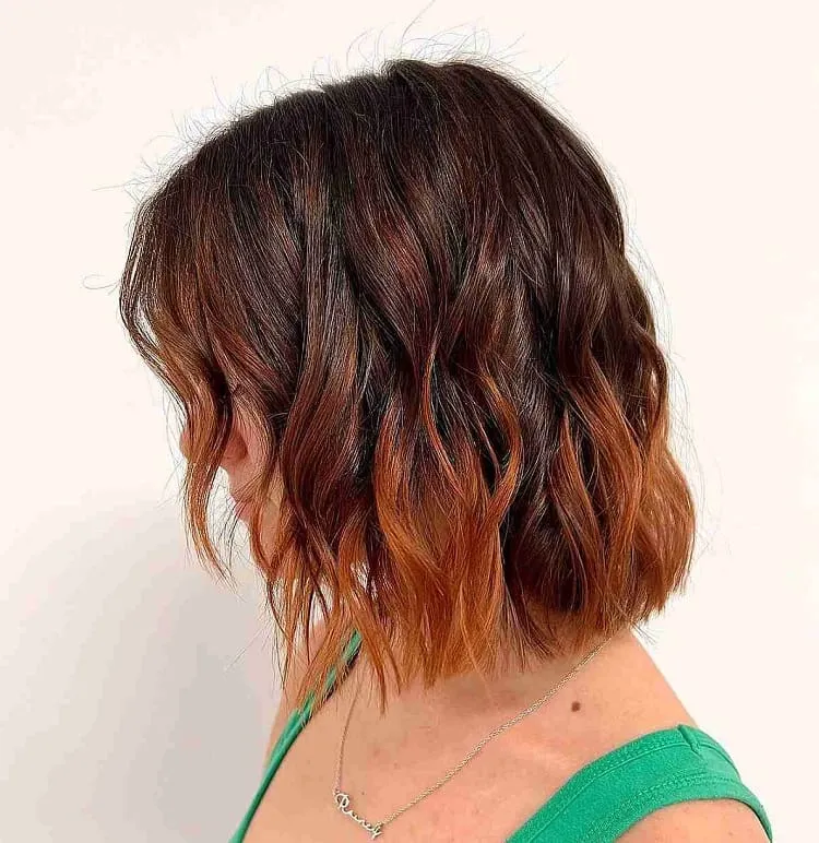dark brunette with bright copper balayage tips