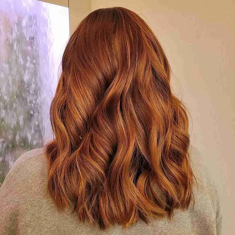 dark strawberry blonde and copper balayage hair