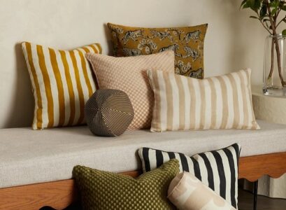 decorative asymmetrical outdoor throw pillows bold patterns stripes earthy colors decoration trends 2023