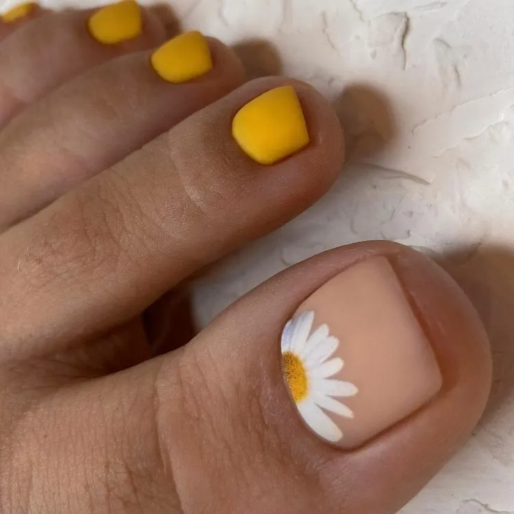 gentle minimalist yellow nude matte summer pedicure design daisy flower accent drawing
