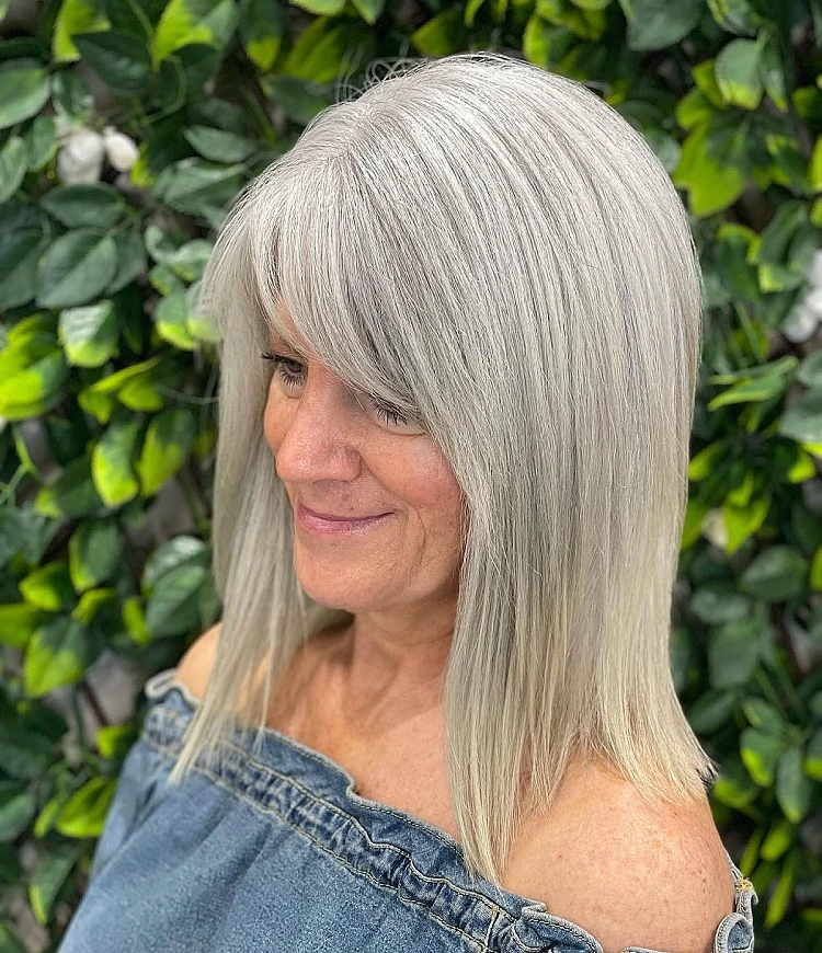 long bob lob hairstyle for women over 50 with bangs