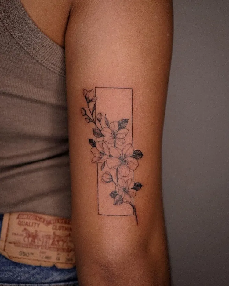 minimalist sakura cherry blossom tattoo idea fine line single needle design