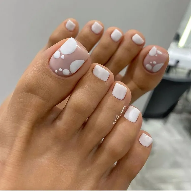 negative space white dots summer pedicure design 2023