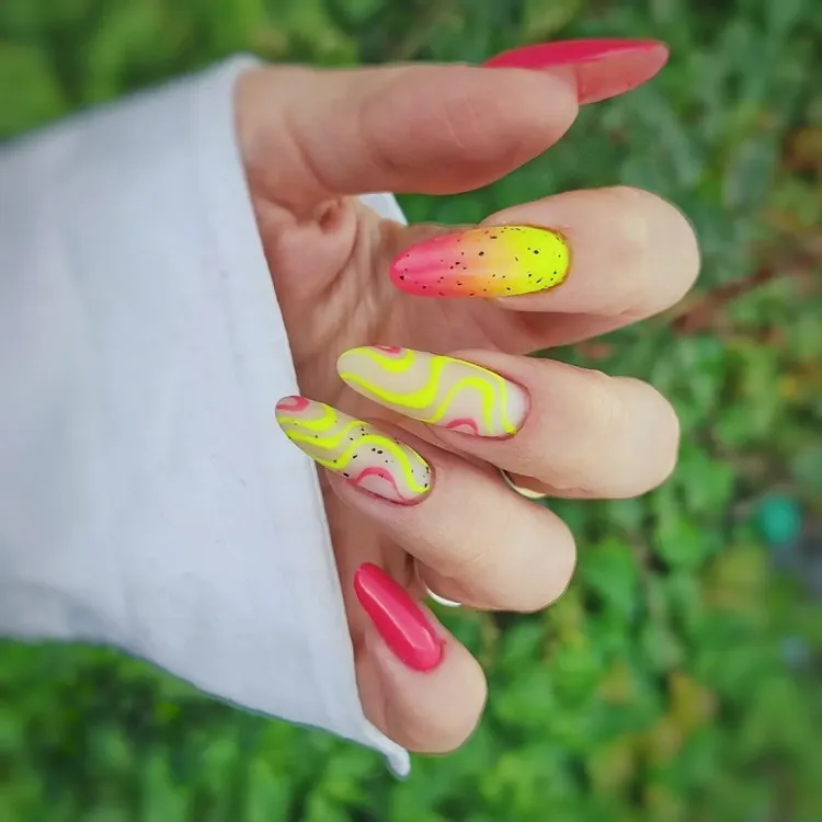 pink orange yellow neon nails matte swirly decorations black splatter summer manicure 2023