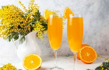 homemade refreshing orange mimosa cocktails with champaigne