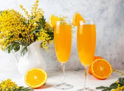 homemade refreshing orange mimosa cocktails with champaigne