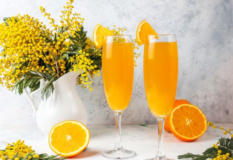 homemade refreshing orange mimosa cocktails with champaigne