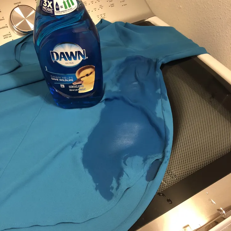 removing oil stains from clothing suggest putting a towel under the stained areas and then applying proven liquid laundry detergent let the product sit for 10 minutes