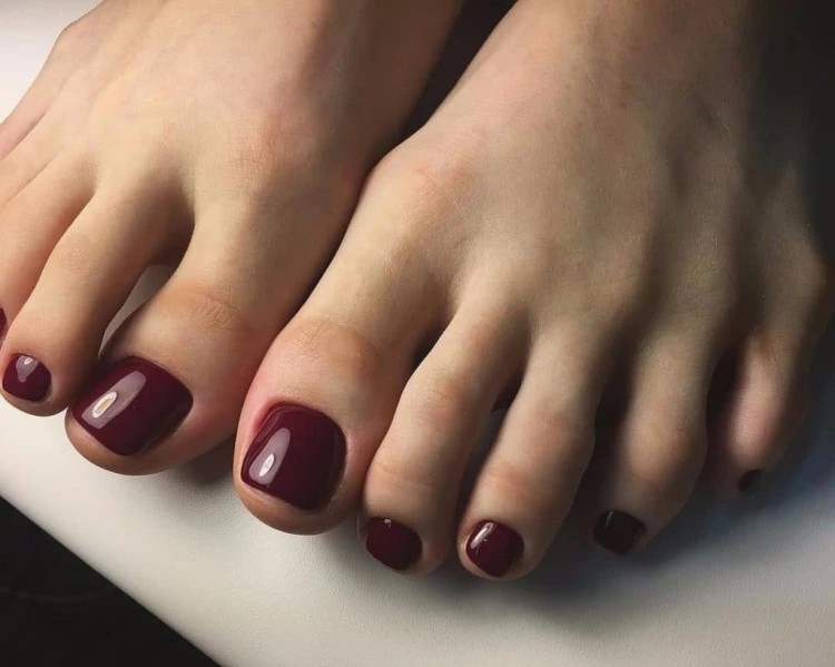 rich burgundy color toenails pedicure idea for women over 50