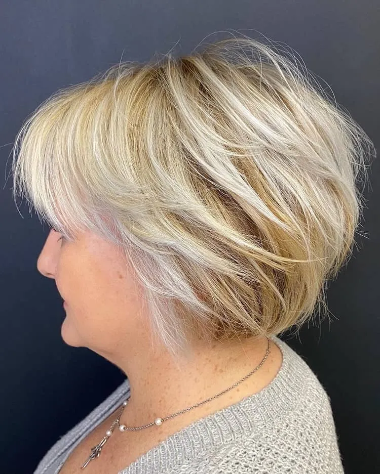 short feathered bob with bangs over 50
