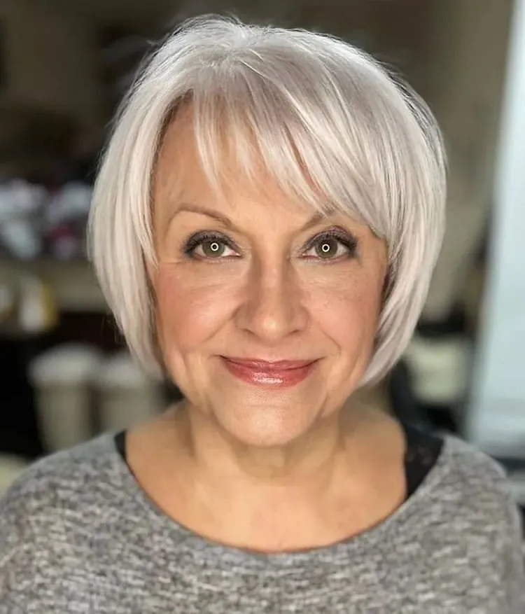 short platinum bob with haircut with bangs for women over 50