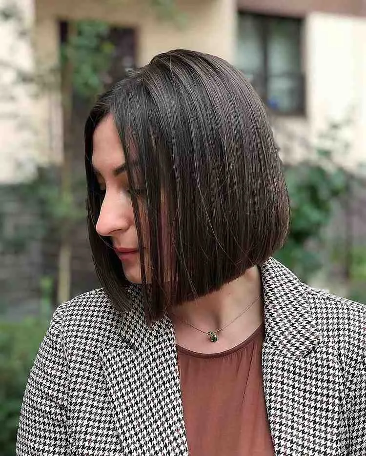 sleek blunt bob with middle part for women over 50