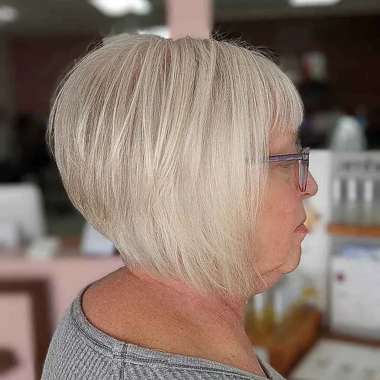 stacked inverted bob with bangs for older women with fine hair