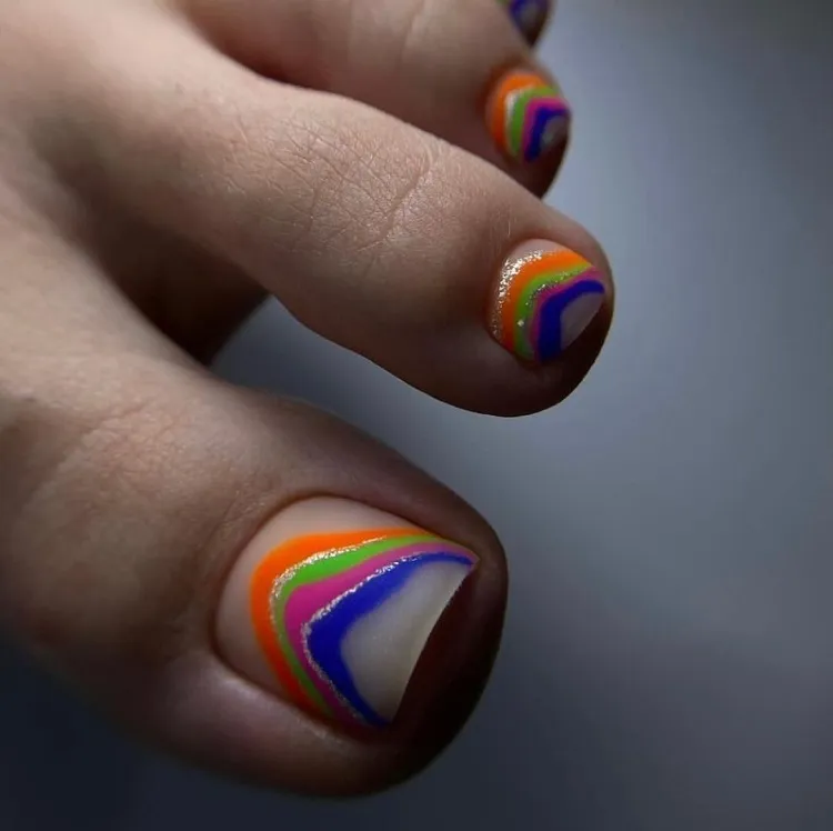 swirly rainbow matte abstract summer pedicure design trend 2023