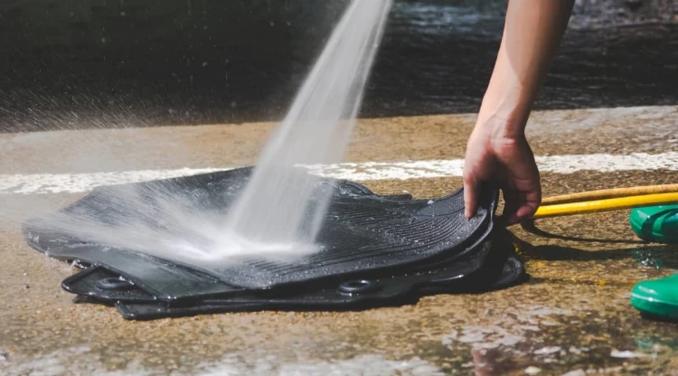 wash rubber car mats with a hose