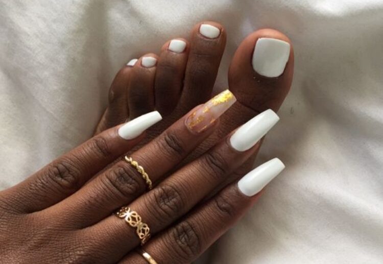 white matching manicure pedicure long ballerina nails gold rings dark skin woman