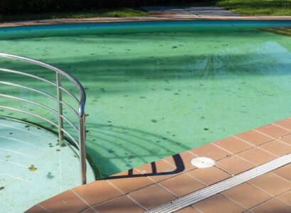 how to clean the bottom of the pool remove sand and algae