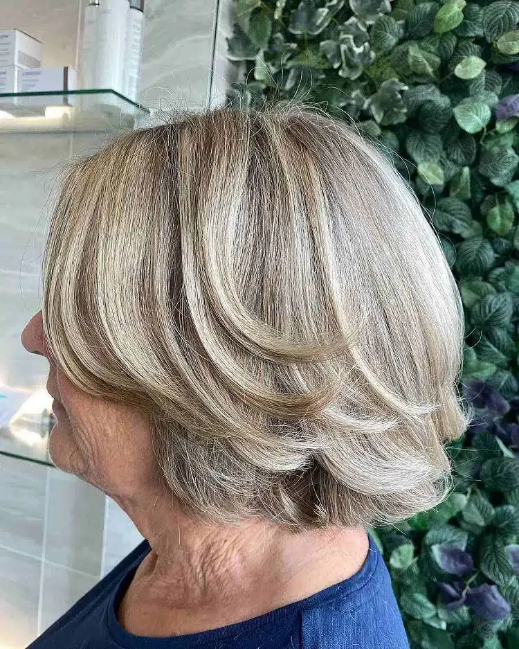 short layered bob for women over 60 with curtain bangs