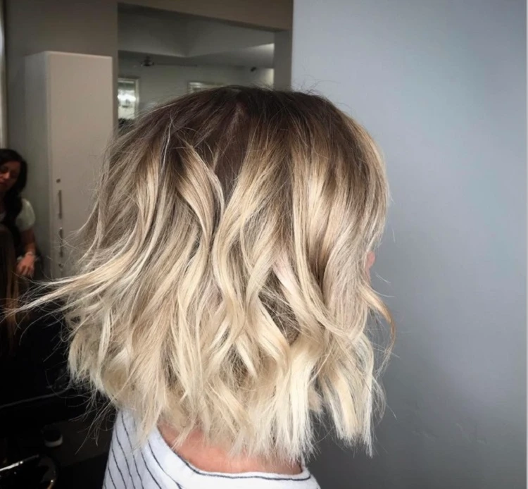 blunt bob haircut with blonde balayage scandi waves