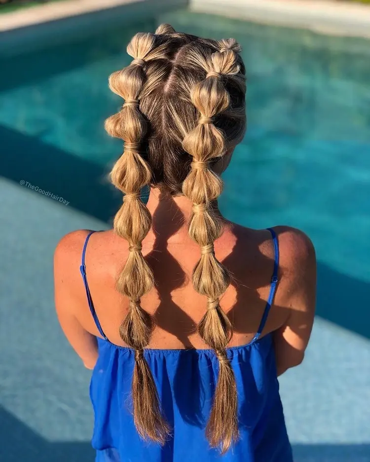 bubble braids hairstyle summer trends 2023 pool