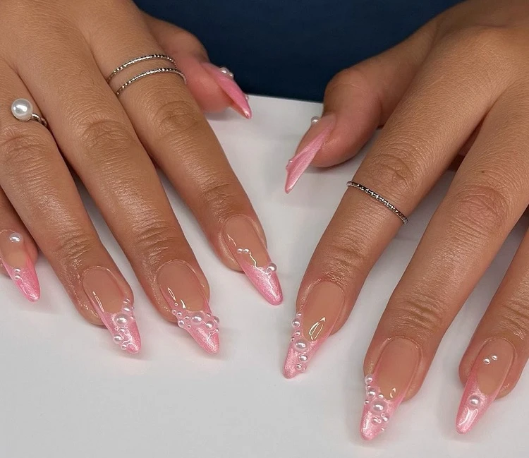 chrome french tip nails in pink with pearl decoration