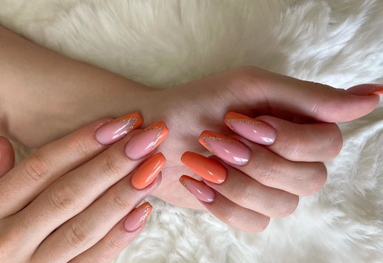 coffin french tip nails with orange and glitter summer 2023
